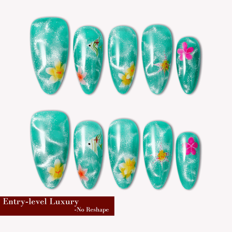 Turquoise glitter almond press-on nails with yellow and pink floral accents arranged in a flat lay