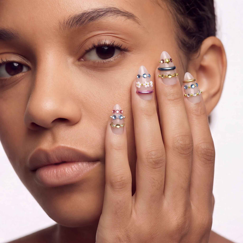 Jewel Band handmade press-on nails in a close-up portrait with nude nails and multicolor gemstone bands