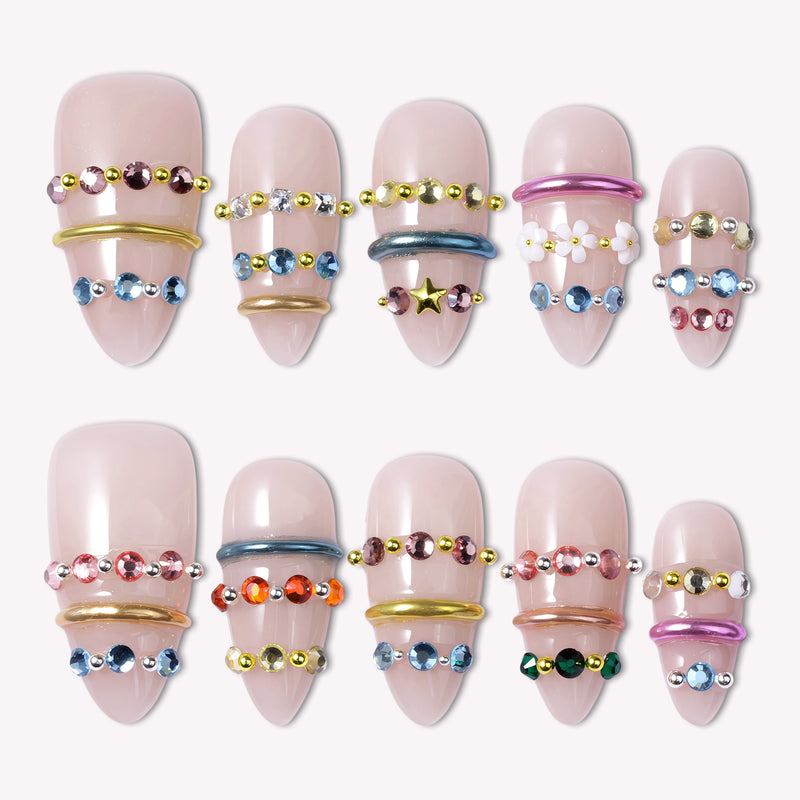 Jewel Band handmade press-on nails with nude bases, multicolor gemstone bands, and metallic ring accents