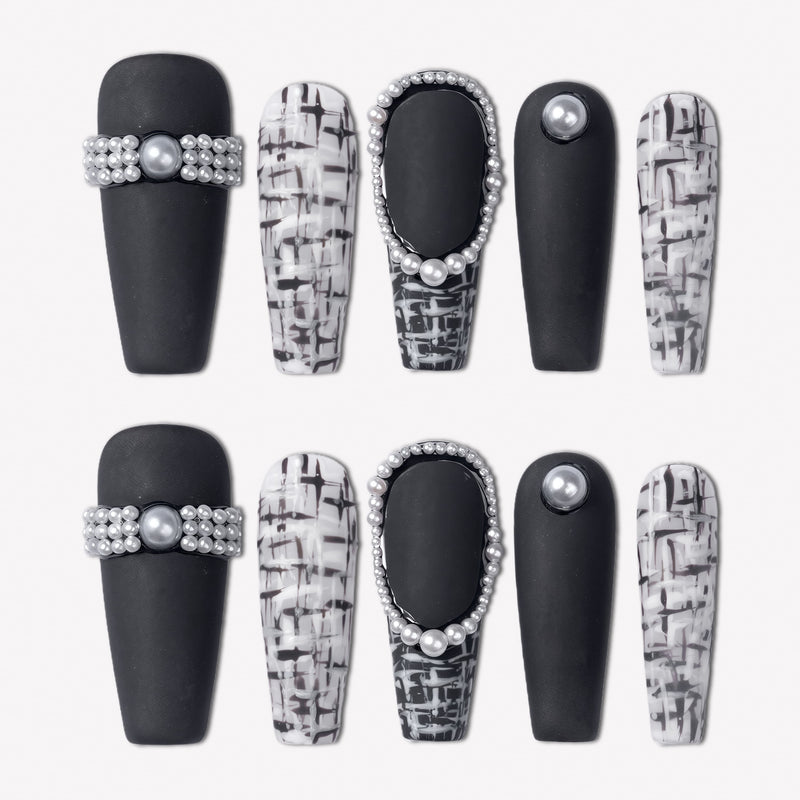 Lace & Pearls press-on nails with black matte tips, black and white lace pattern accents, and pearl rhinestone details