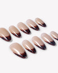 Angled flat lay of Leopard French press-on nails with glossy nude bases and deep brown black animal print French tips