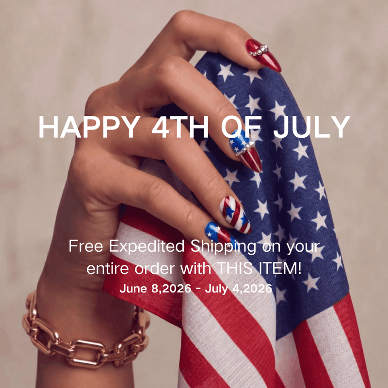 Patriotic hand model holding an American flag cloth with red, white, and blue press-on nails for a 4th of July promotion.