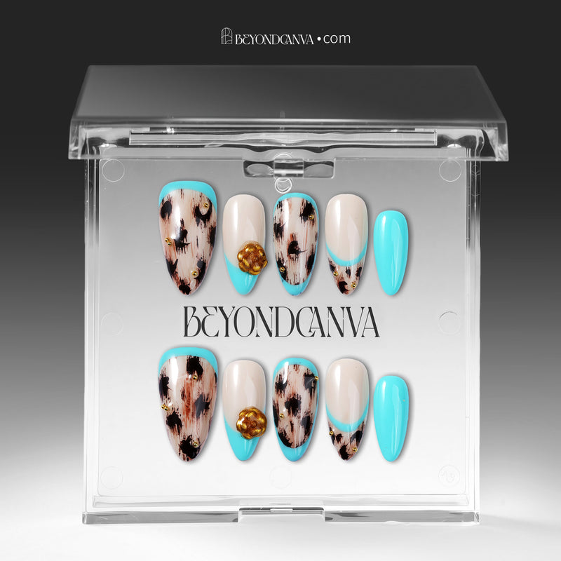 Press-on nails displayed inside a clear BeyondCanva case with turquoise and cream abstract designs and gold accents