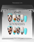 Press-on nails displayed inside a clear BeyondCanva case with turquoise and cream abstract designs and gold accents
