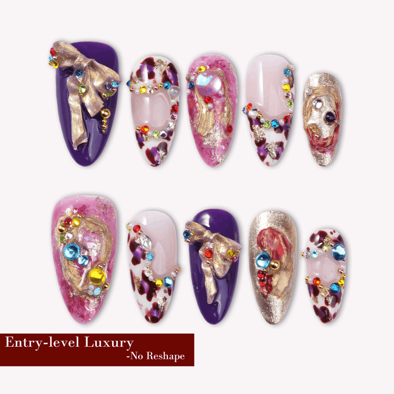 A set of ten luxury almond-shaped press-on nails featuring royal purple with 3D gold bow charms, magenta marble patterns, and multi-colored rhinestone decorations on a white background