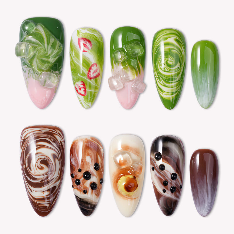 Matcha & Boba handmade press on nails arranged in a white flat lay with green, brown, and creamy swirled designs