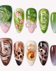 Matcha & Boba handmade press on nails arranged in a white flat lay with green, brown, and creamy swirled designs