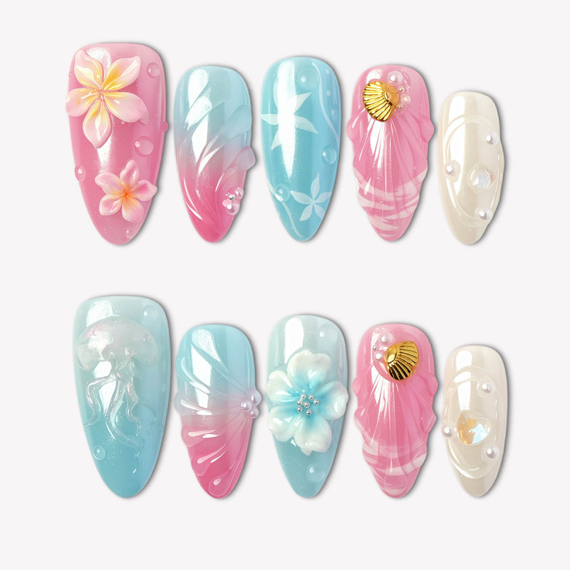 Mermaid Mood pink and blue press-on nails with shells, flowers, pearls and water drop details