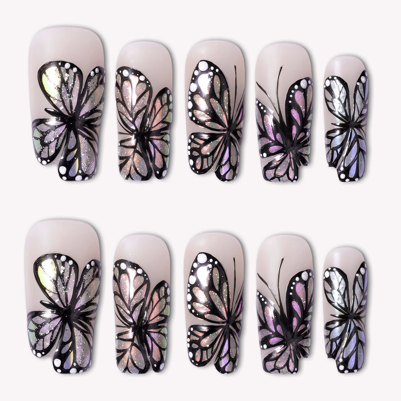 Midnight Monarch irregular shaped handmade press-on nails with black butterfly wing designs and iridescent shimmer