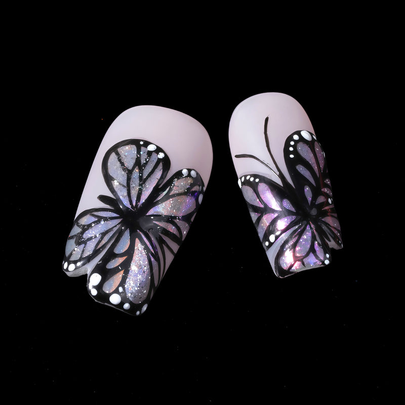 Midnight Monarch irregular shaped handmade press-on nails close-up with black butterfly wing designs and iridescent shimmer