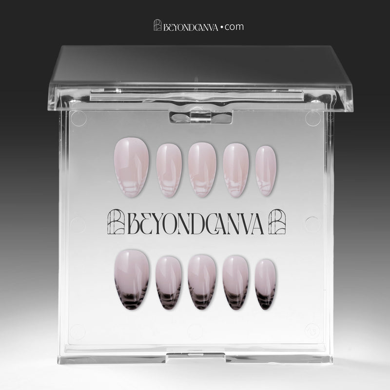Mist Fade press-on nails in nude gray with smoky black-and-white tips displayed in a clear packaging box