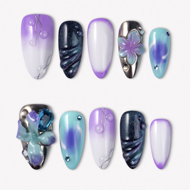 Moon Orchid purple, aqua and black press-on nails with raised orchid flowers, blue gems, silver lines and shimmer