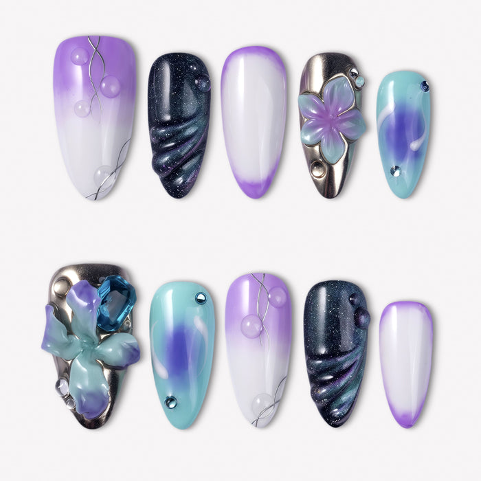Moon Orchid purple, aqua and black press-on nails with raised orchid flowers, blue gems, silver lines and shimmer