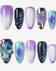 Moon Orchid purple, aqua and black press-on nails with raised orchid flowers, blue gems, silver lines and shimmer