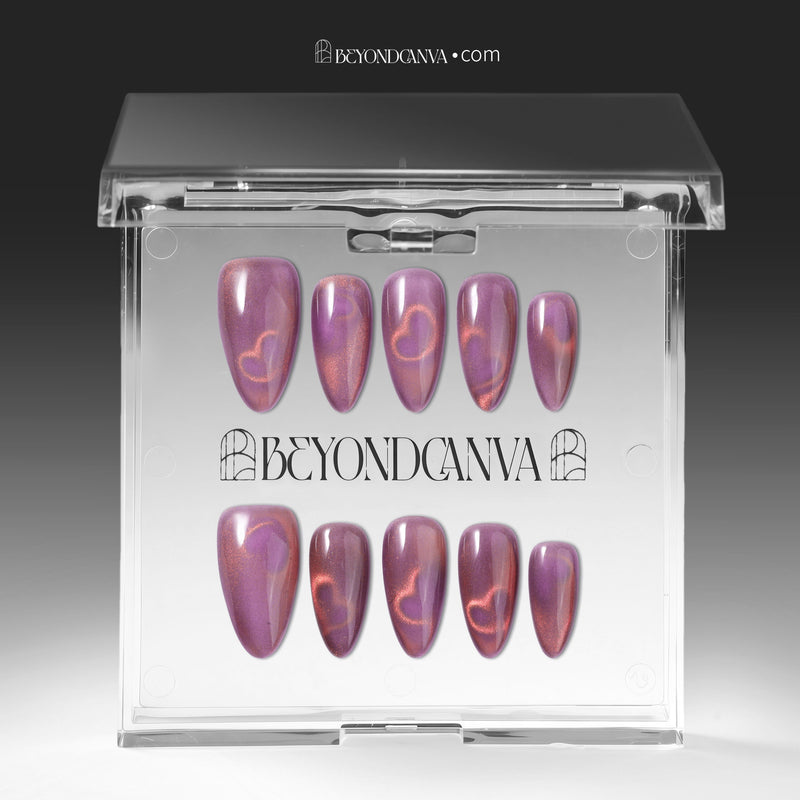 Nebula Kiss purple and pink cat-eye heart press-on nails displayed in a clear Beyondcanva storage case