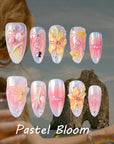 Pastel Bloom press-on nails style card with pink, blue and yellow floral designs, pearls and rhinestones
