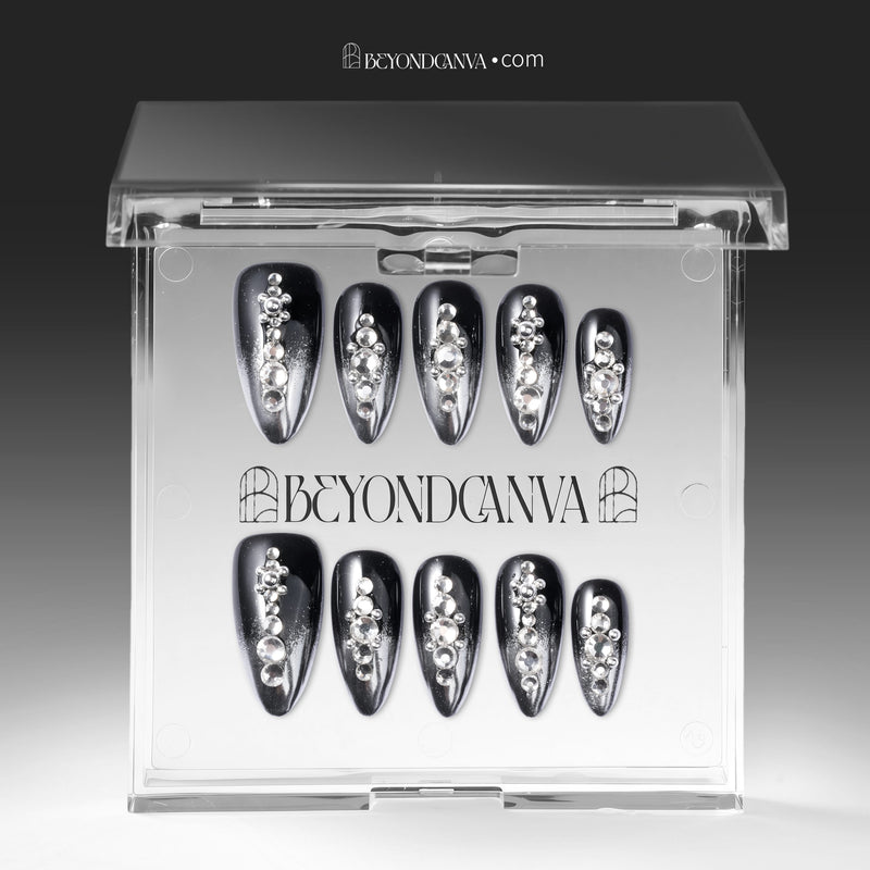 Obsidian Stardust handmade press-on nails displayed in a clear case with black chrome finish and silver rhinestones