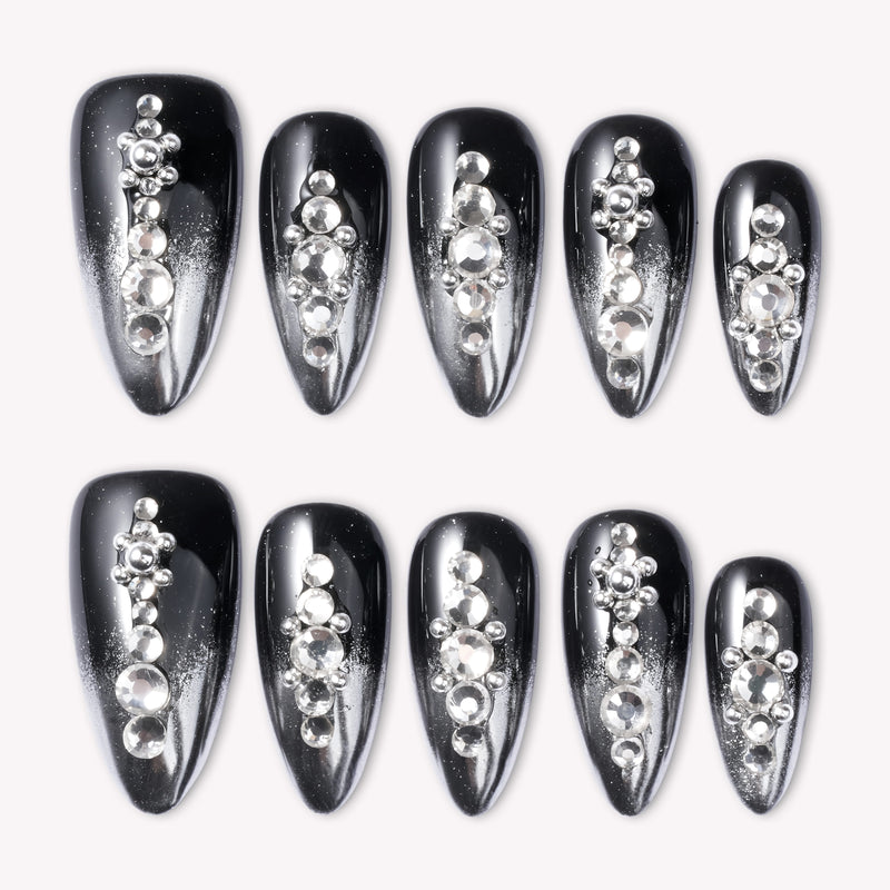 Obsidian Stardust handmade press-on nails in glossy black with silver rhinestone accents