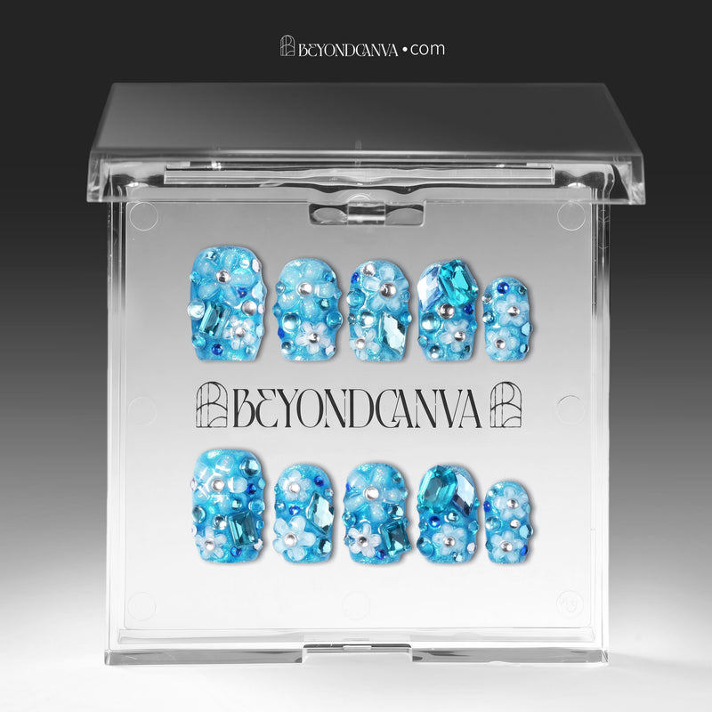 Packaging display of Ocean Sparkle Bloom handmade press-on nails inside a clear box with BEYONDCANVA branding.