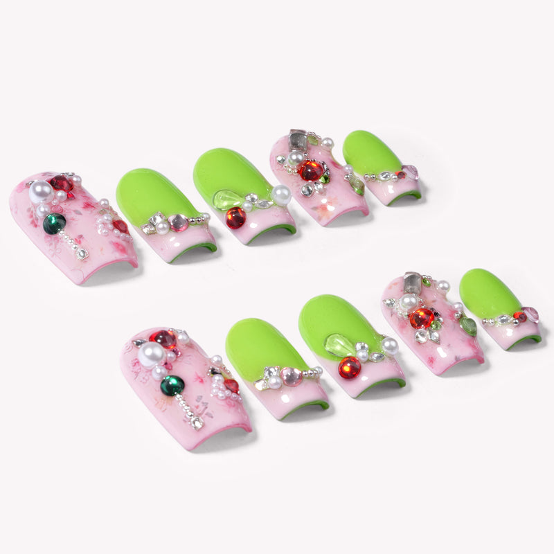 Pastel Dream handmade press-on nails arranged in two rows on a white background with pink marbled bases, lime tips, and jeweled accents