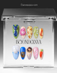 Cartoon-themed press-on nails displayed in a clear BeyondCanva case with blue, pink, green, yellow, and orange accents