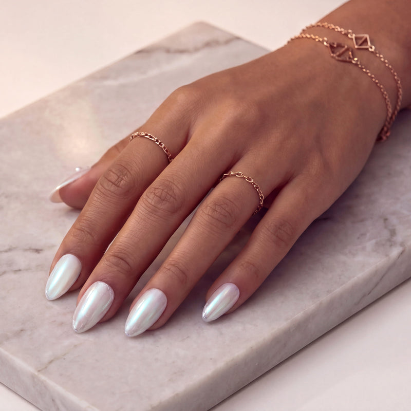 Pearl white iridescent press-on nails with subtle gemstone accents