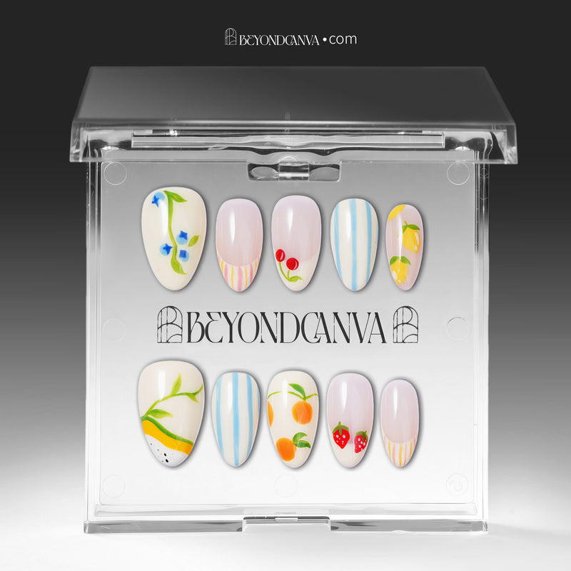 Set of handmade press-on nails with fruit motifs, blue stripes, and pastel accents arranged on a white background.