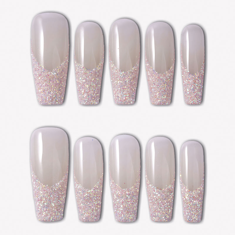 Pink Confetti press-on nails with sheer nude pink square bases and sparkling pink silver glitter French tips in a confetti gradient