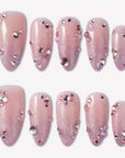 Pink Fairy Dust press-on nails with soft pink shimmer, cat-eye sparkle, and scattered pink purple silver rhinestones