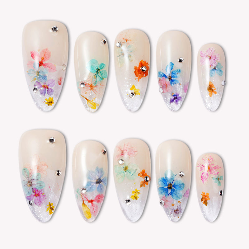Floral press-on nails displayed in two rows on a white background.