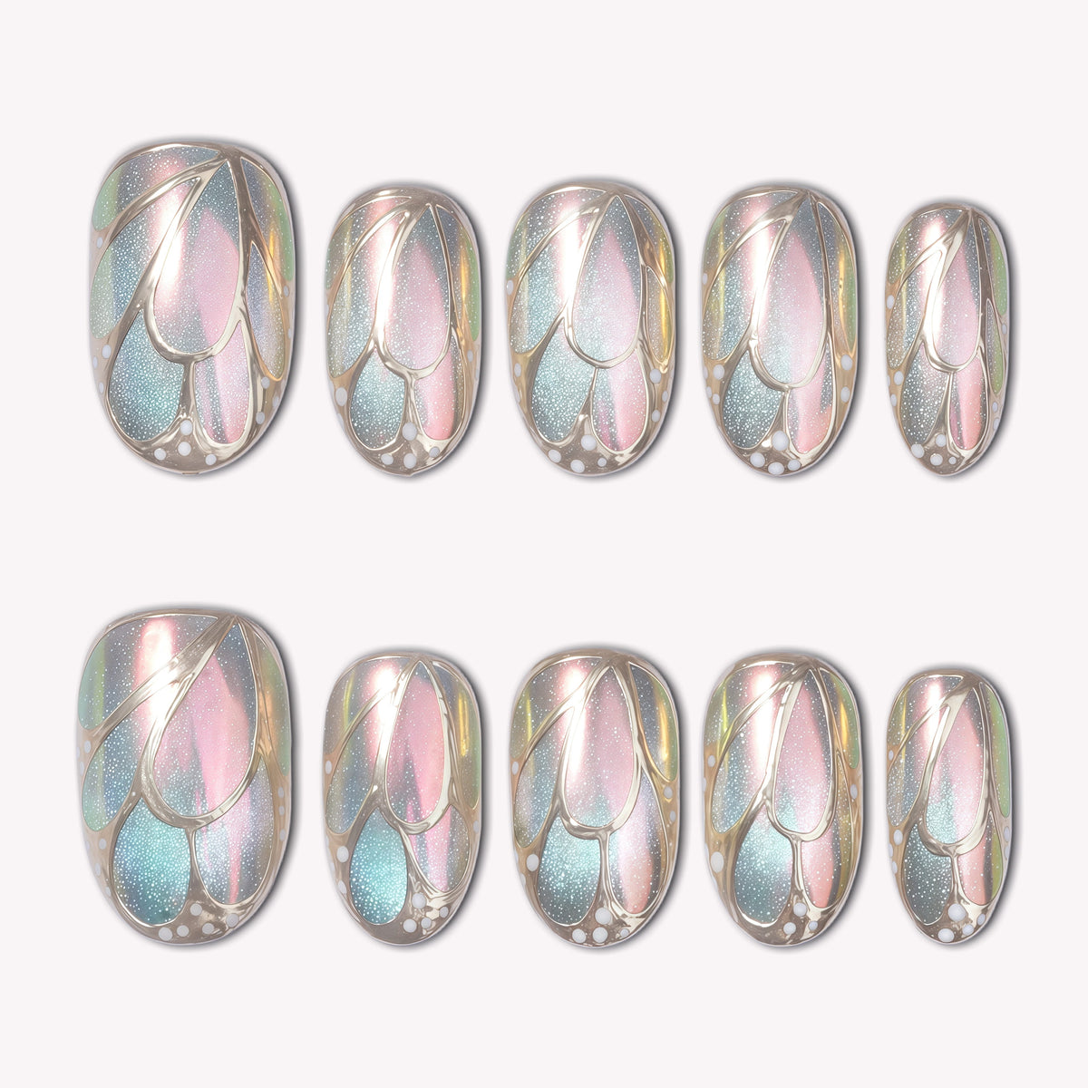 A set of iridescent pastel press-on nails with leaf-like metallic outlines on a white background