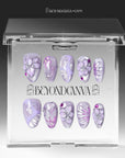 Purple Dream lavender floral press-on nail set arranged inside a clear Beyondcanva display case