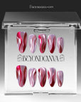 Rose Drift cat eye almond press-on nails displayed in a clear Beyondcanva packaging case with pink and burgundy wave designs
