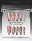 Rose Veil Aureate press-on nails displayed in clear packaging with blush pink, ivory, and gold foil accents