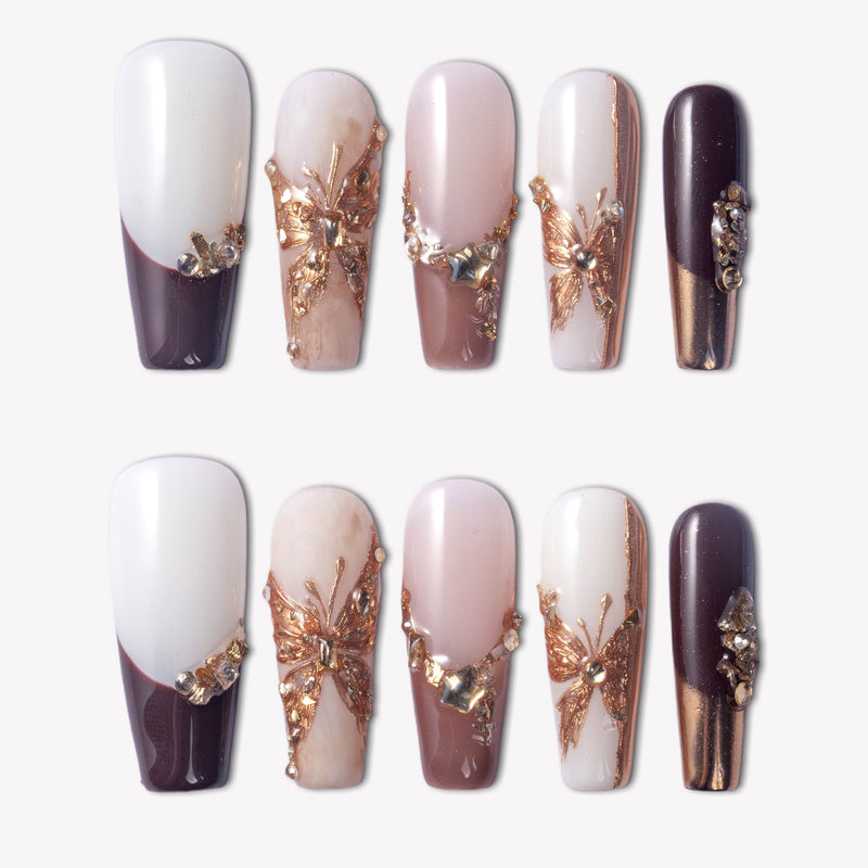 Rosegold Flutter press-on nails with burgundy, pink, and white glossy designs, rosegold butterfly charms, and rhinestone accents