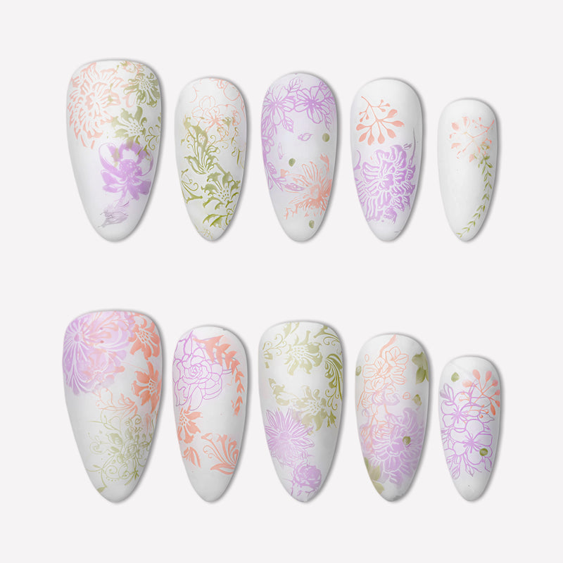 Secret Garden press-on nails with pastel pink, lavender, and sage floral patterns on a white flat lay background