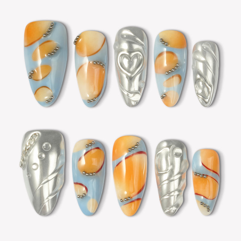 Solar Pulse orange, pale blue and silver press-on nails with chrome hearts, swirls and bead accents