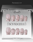 Packaging display of Sugar Kitten press-on nails with nude pink bases, leopard French tips, and rhinestone accents in a clear BeyondCanva case