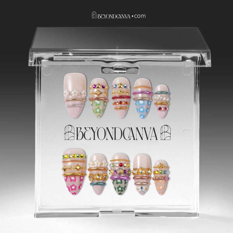 Sunset Gypsy handmade press-on nails displayed inside clear packaging with two sets of decorated nails on a white insert