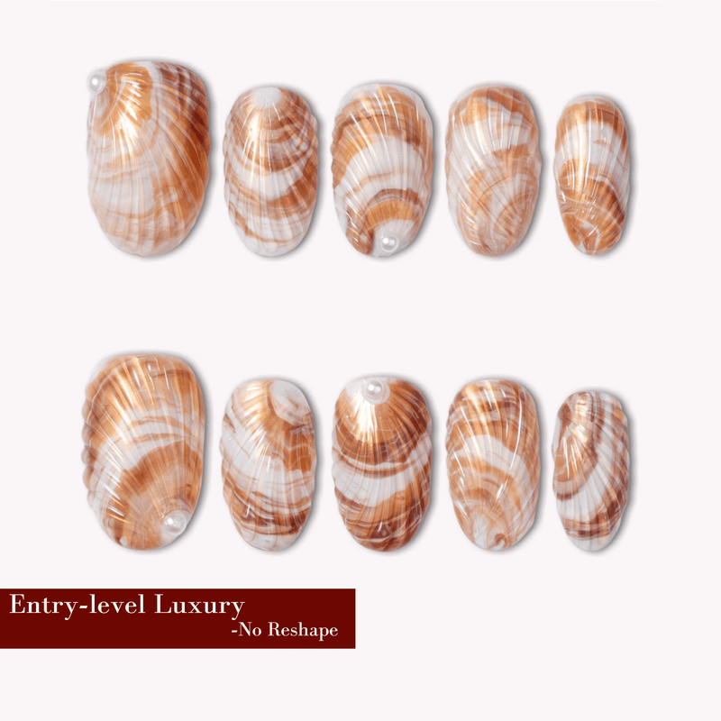 Brown and white shell-pattern press-on nails with a glossy finish arranged on a white background.