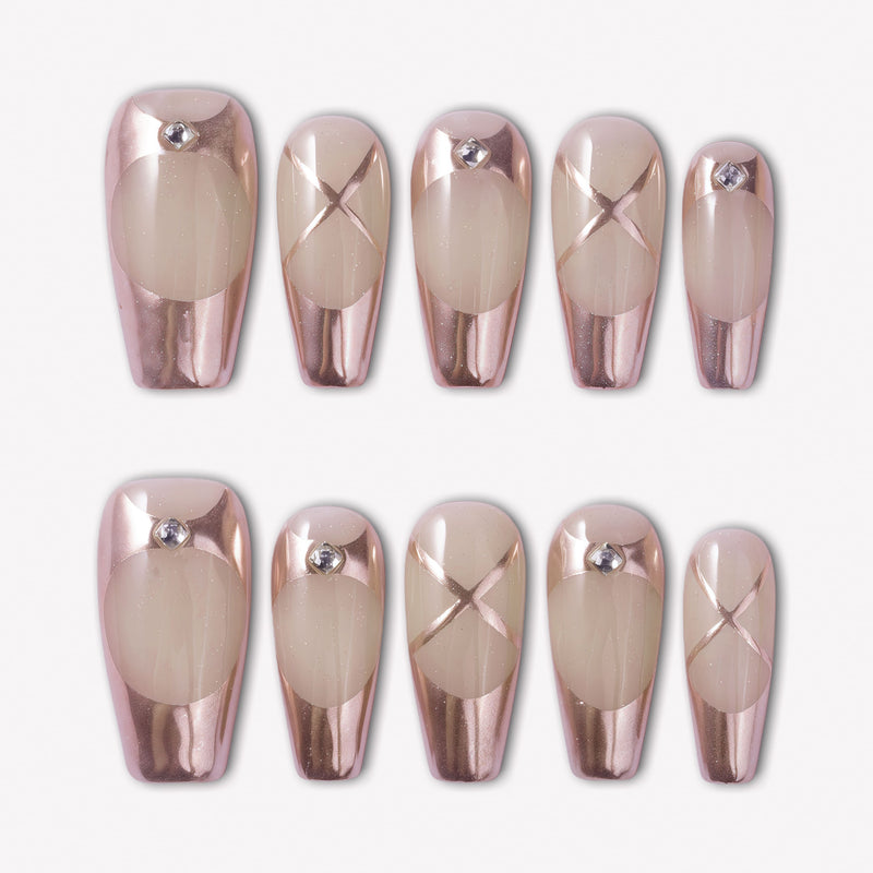 Swan Lake Dream press-on nails with rose gold metallic French tips, nude jelly bases, crisscross accents, and rhinestones