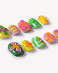 Individual Tropical Jelly Bloom press-on nails arranged on a white background with floral and wavy green, pink, yellow, and orange designs