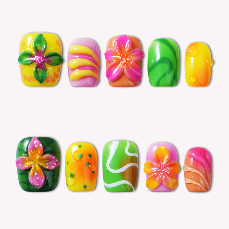 Tropical Jelly Bloom press-on nails in bright yellow, pink, green, and orange floral designs on a white background